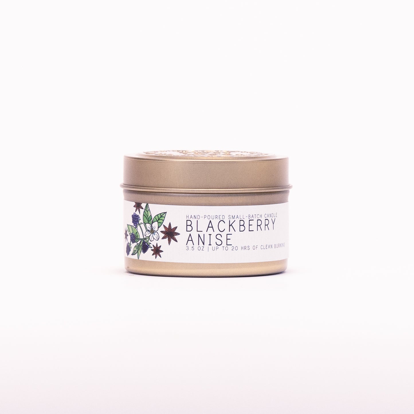 Just Bee Blackberry Anise candle in a closed gold travel tin, blackberry and anise label facing forward.