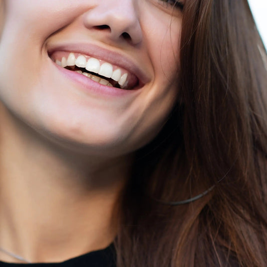 Close-up of a smiling woman's lips and teeth