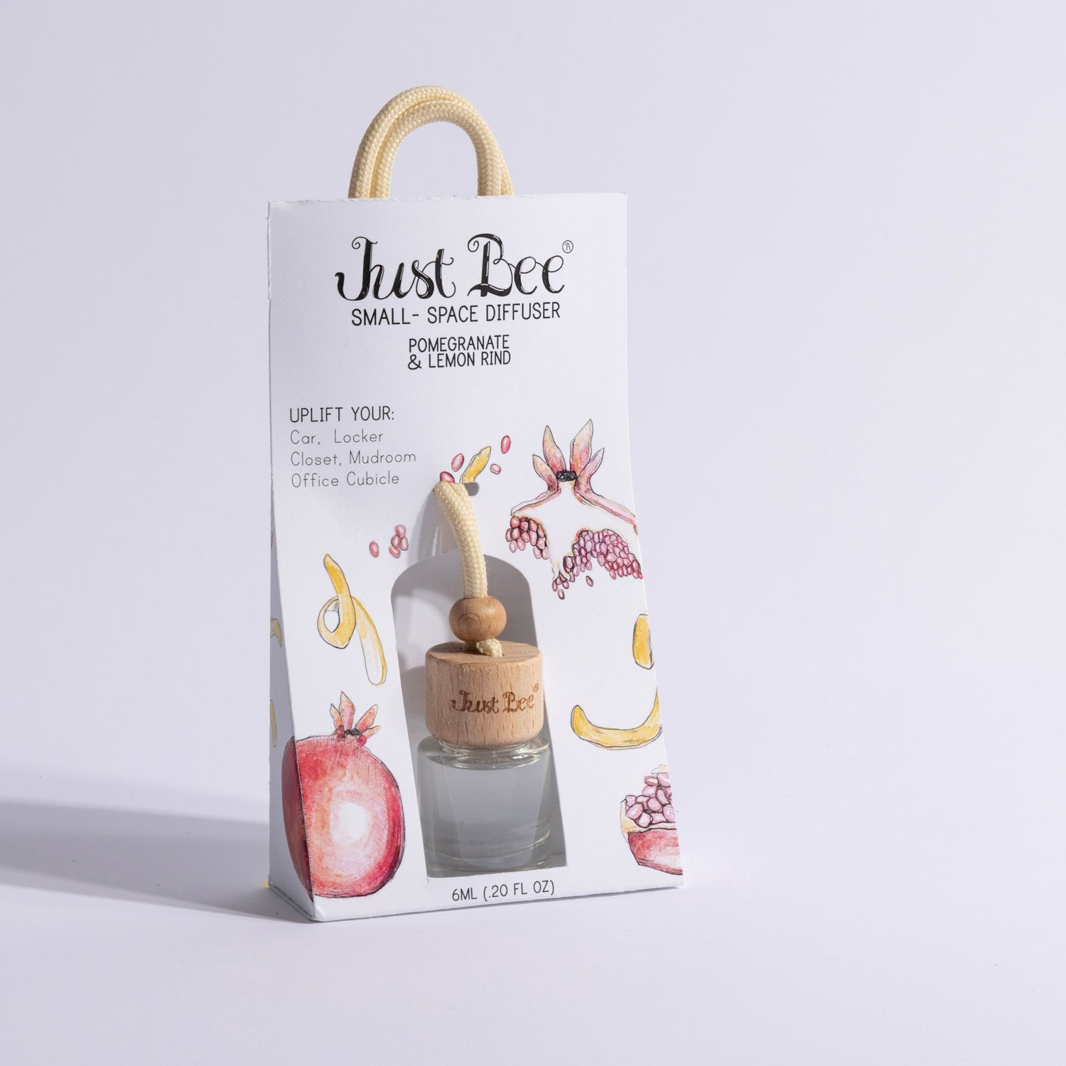 Just Bee Small-Space Hanging Diffuser gift bag labeled Pomegranate & Lemon Rind with fruit illustration packaging, slightly different angle.