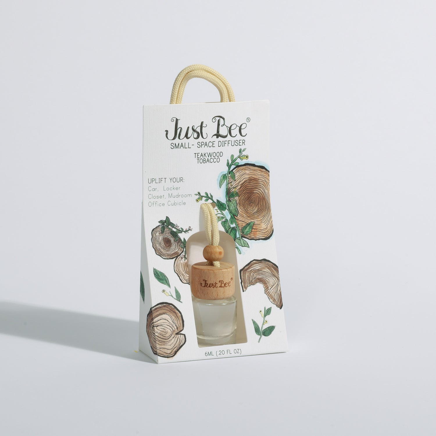 Just Bee Small-Space Hanging Diffuser gift bag labeled Teakwood Tobacco with a light wooden lid and floral packaging.