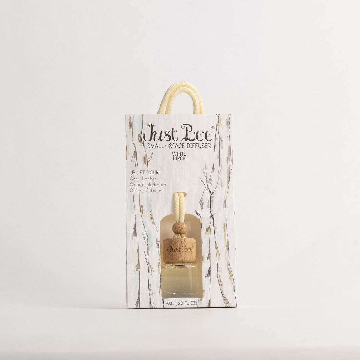 Just Bee White Birch Small-Space Hanging Diffuser, bottle in a pack front painted with slender birch trunks, straight-on.