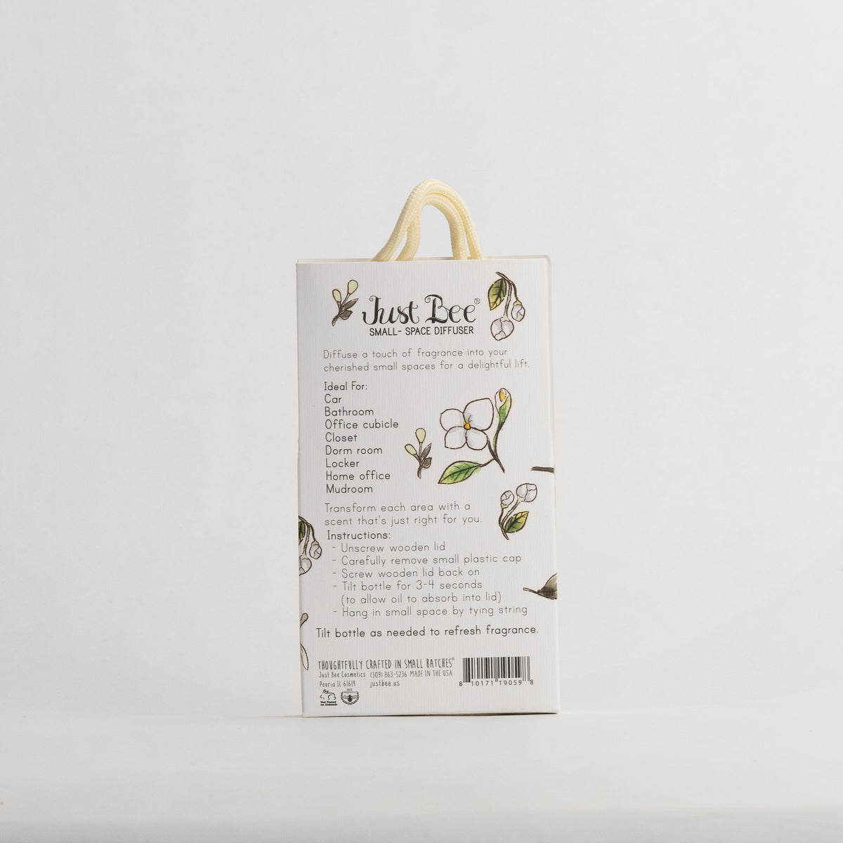 Just Bee Jasmine & Orange Blossom Small-Space Hanging Diffuser, angled back of the pack with a white blossom sprig.