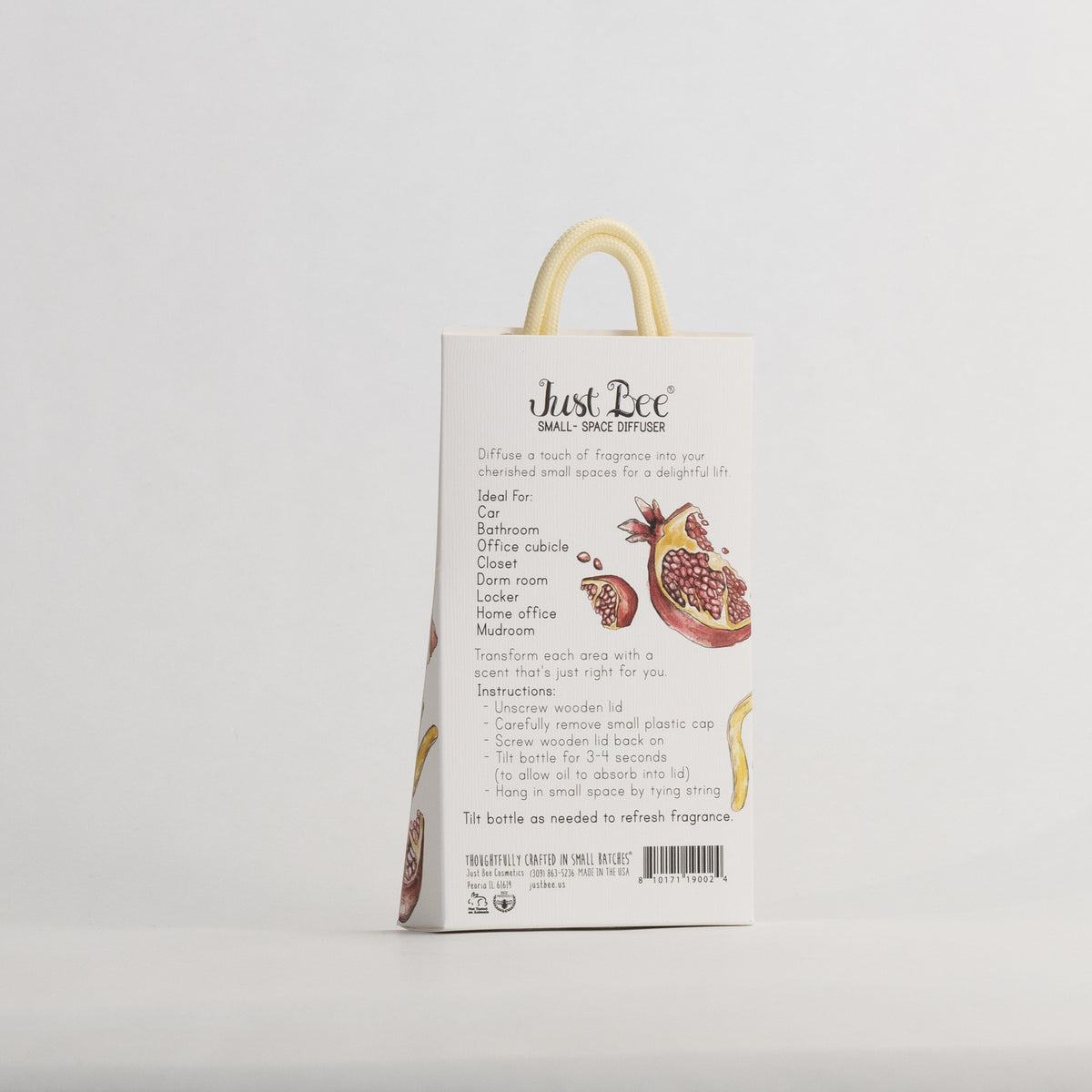 Just Bee Pomegranate & Lemon Rind Small-Space Hanging Diffuser, angled back of the pack with pomegranate and lemon art.