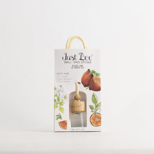 Just Bee Blood Lime & Green Tea Small-Space Hanging Diffuser, pack front painted with red-fleshed citrus halves.
