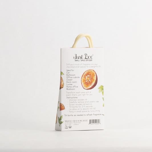 Just Bee Blood Lime & Green Tea Small-Space Hanging Diffuser, angled back of the pack with a red citrus slice.