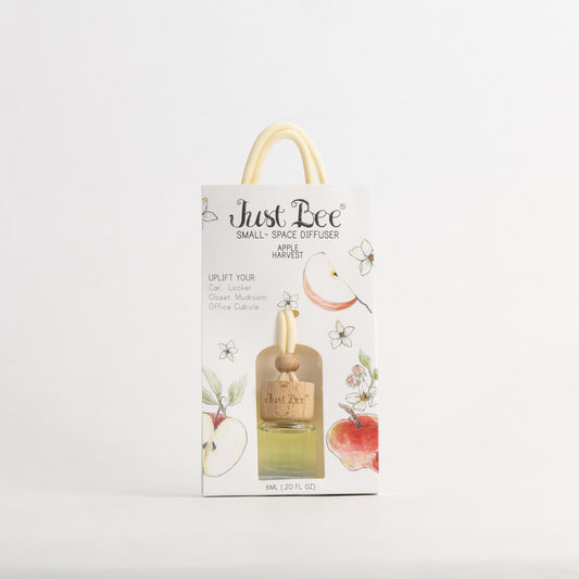 Just Bee Apple Harvest Small-Space Hanging Diffuser, pack front painted with a curling apple peel and blossoms.