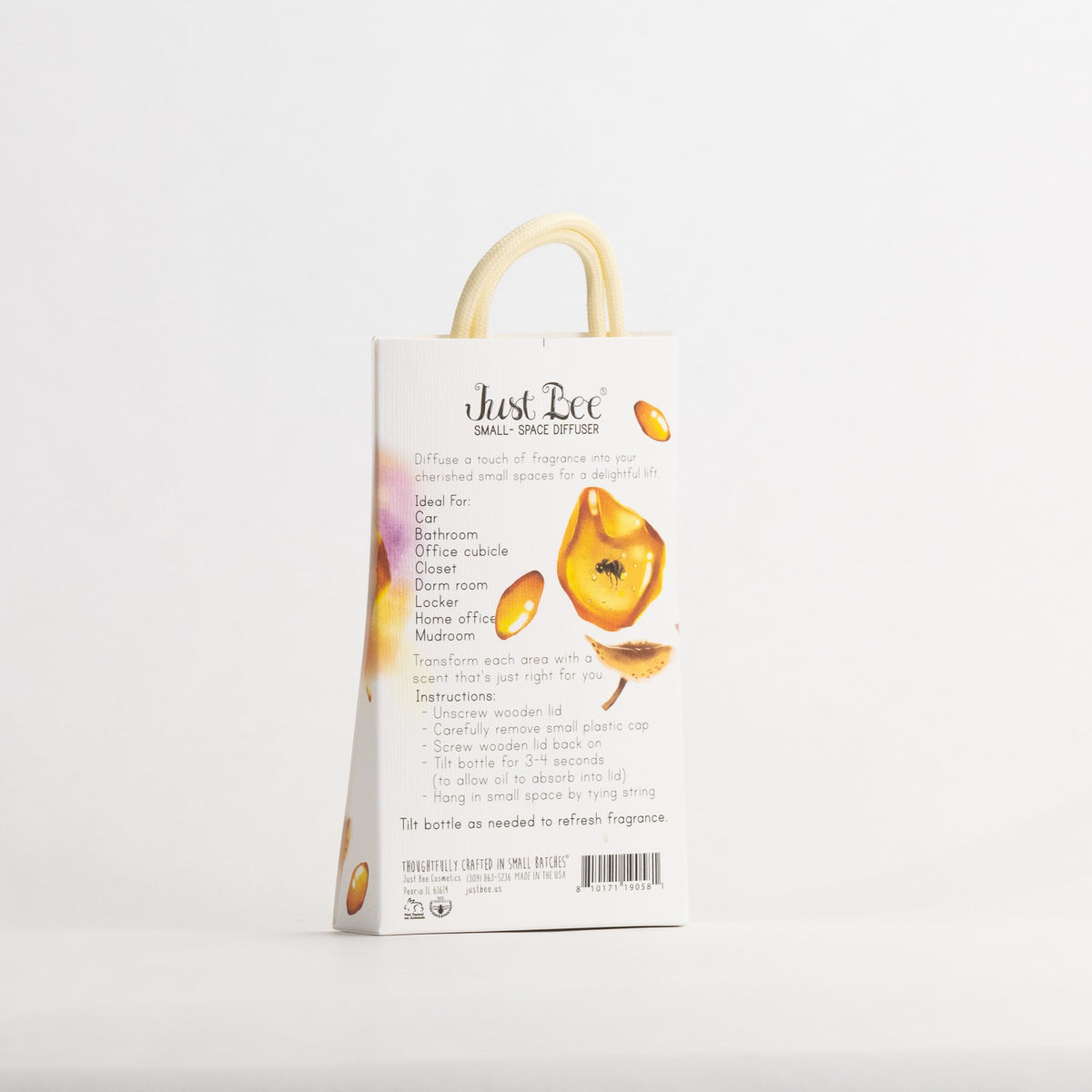 Just Bee Golden Amber Small-Space Hanging Diffuser, angled back of the pack with amber resin art and usage details.
