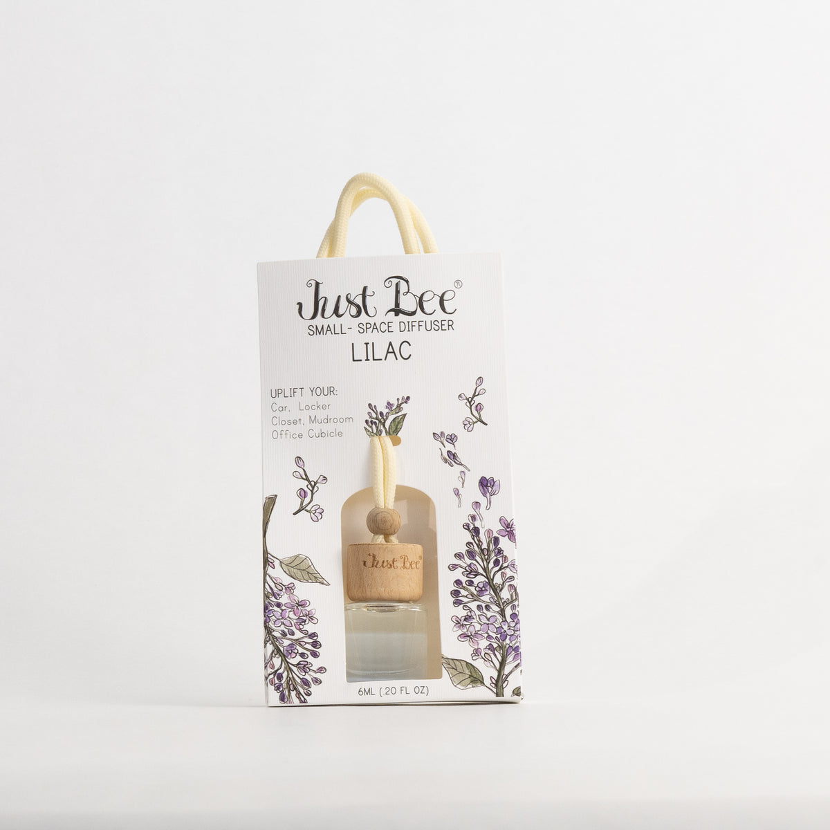 Just Bee Lilac Small-Space Hanging Diffuser, bottle with a wooden lid in a pack front painted with purple lilac sprigs.