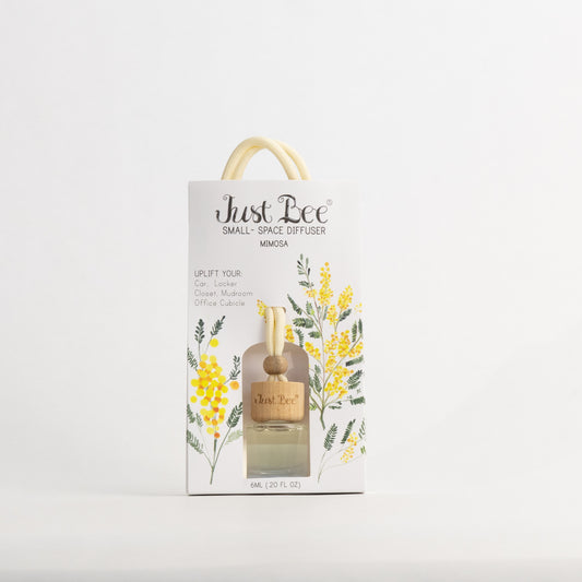 Just Bee Mimosa Small-Space Hanging Diffuser, bottle in a pack front painted with yellow mimosa blossoms, straight-on.