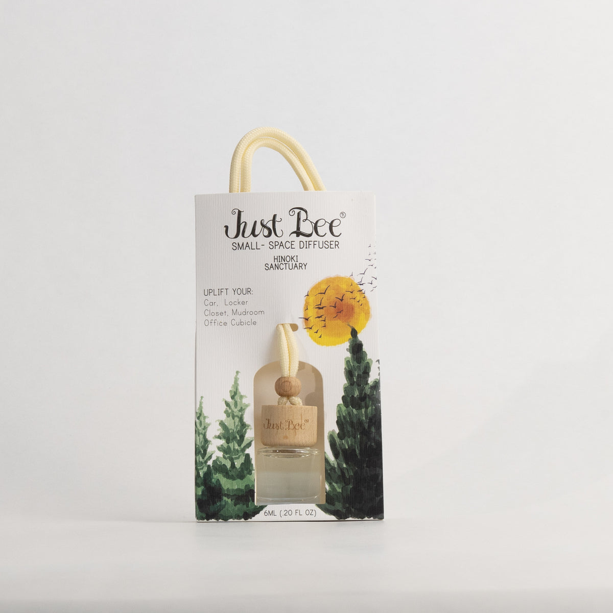 Just Bee Hinoki Small-Space Hanging Diffuser, pack front labelled Hinoki Sanctuary with a golden sun over conifers.