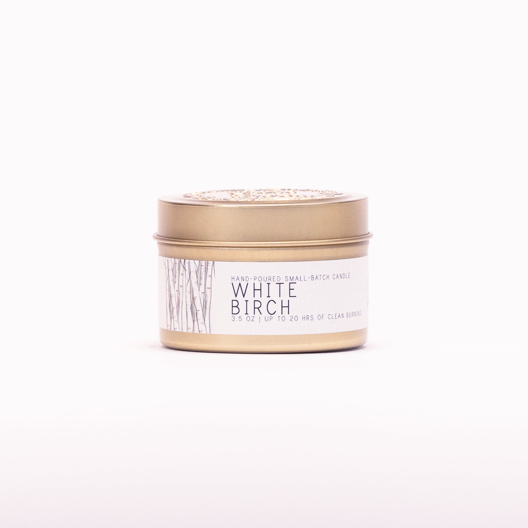 Just Bee White Birch candle in a closed gold travel tin, birch trunk label facing forward.