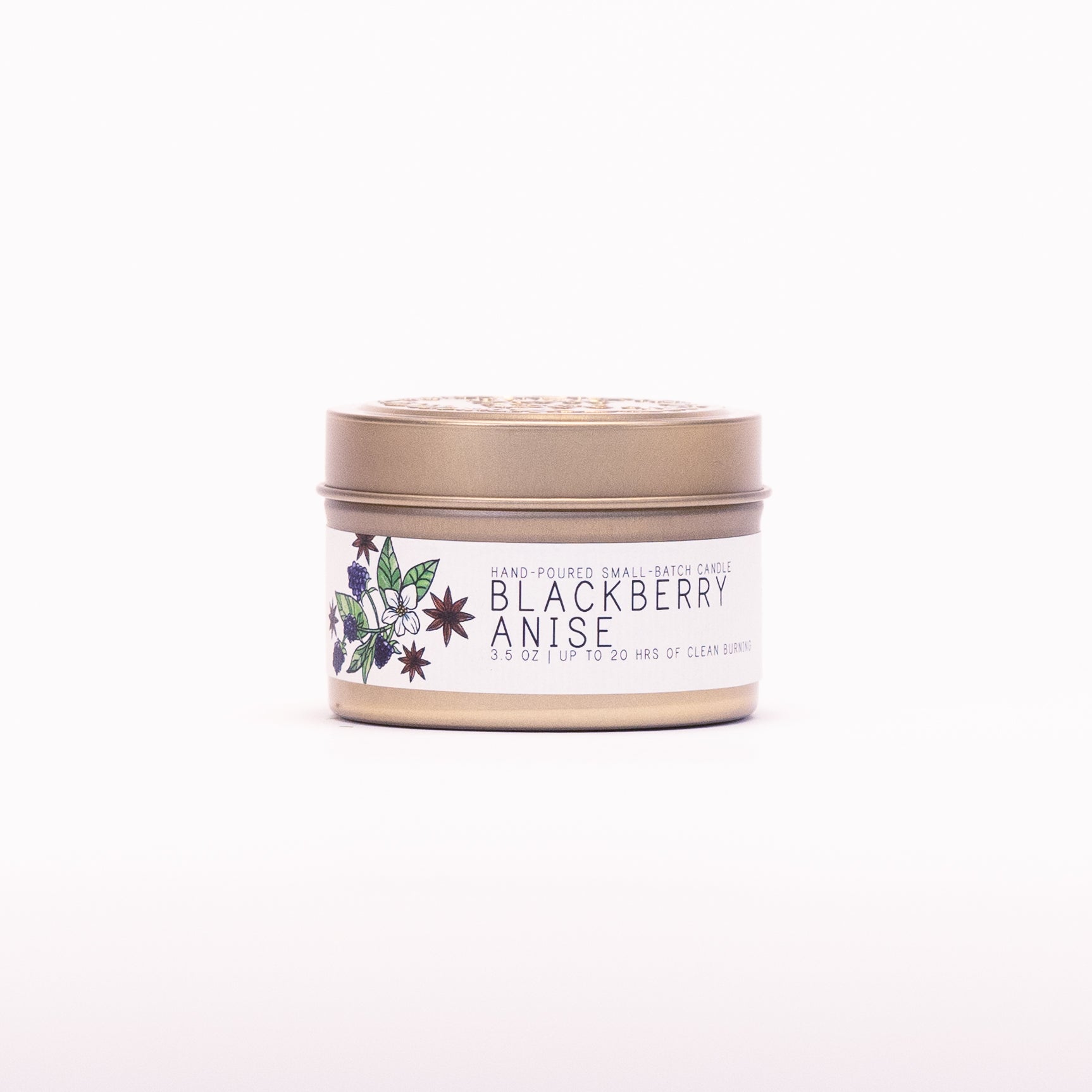 Just Bee Blackberry Anise candle in a closed gold travel tin, blackberry and anise label facing forward.