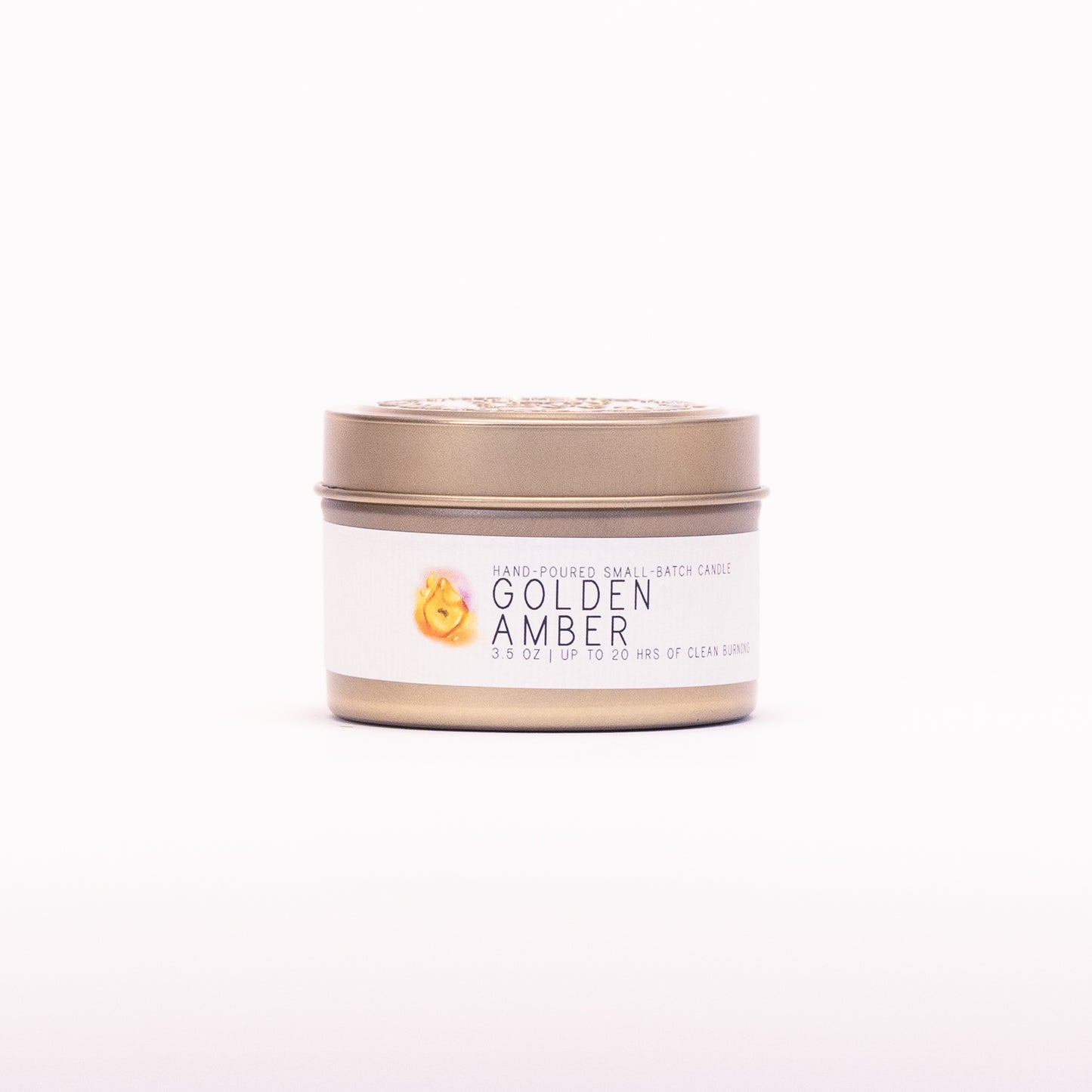 Just Bee Golden Amber candle in a closed gold travel tin, amber resin label facing forward.