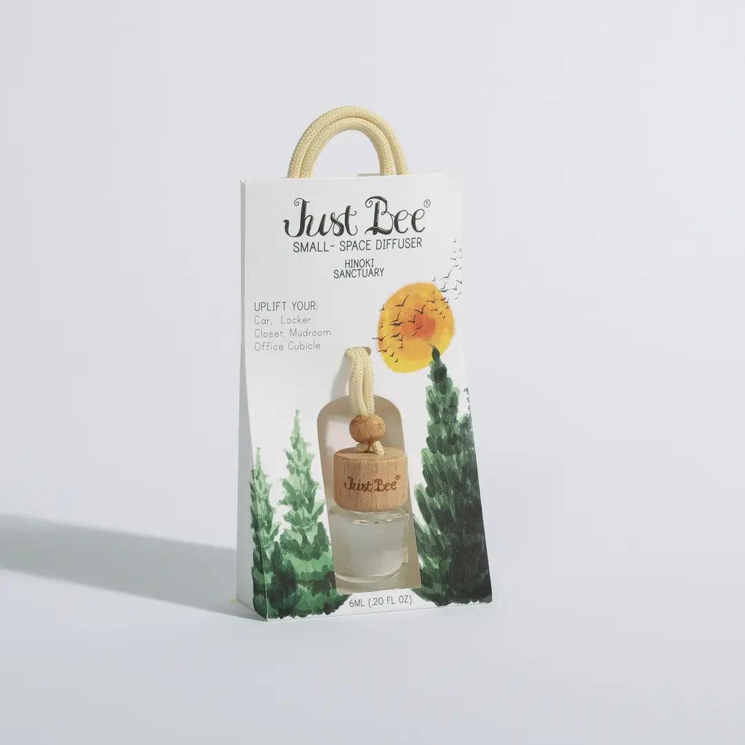 Just Bee Small-Space Hanging Diffuser gift bag in Hinoki scent, featuring pine tree illustration packaging, slightly different angle.